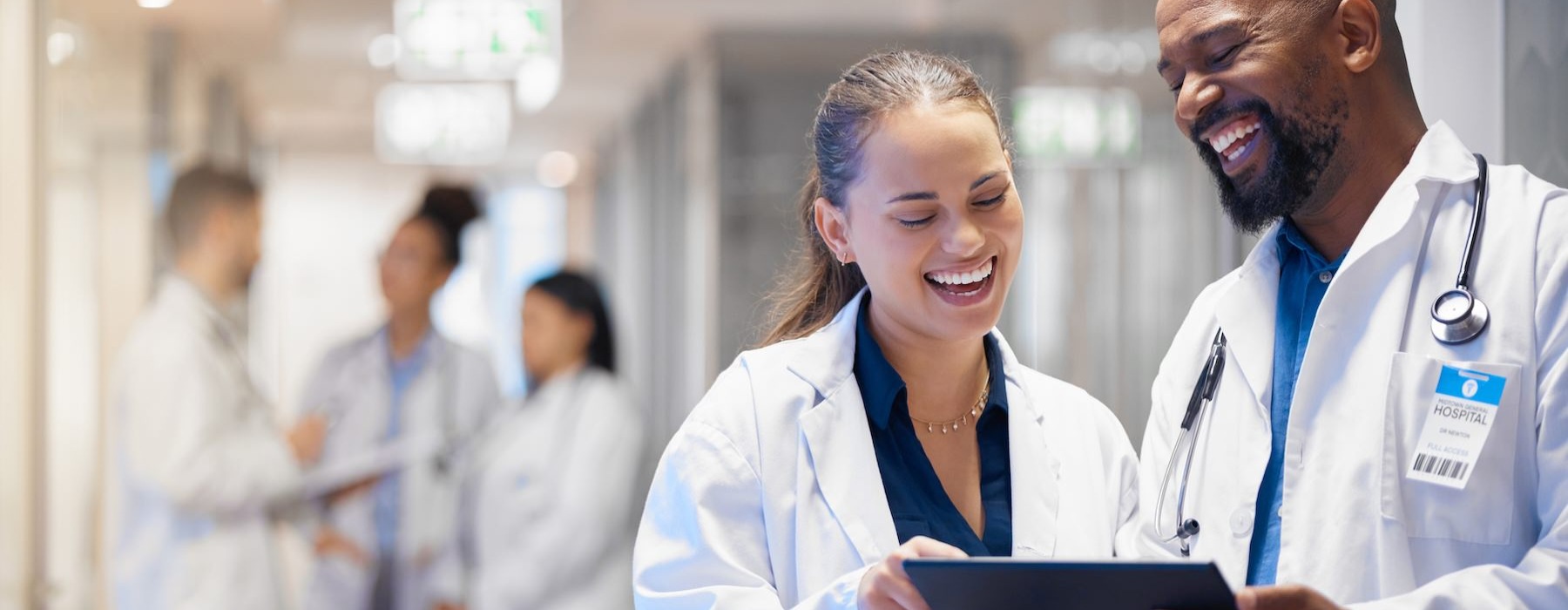 two medical professionals smiling